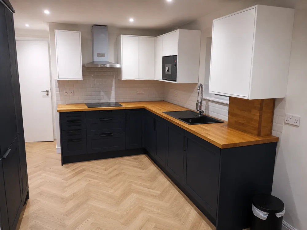 Design inspiration: navy shaker kitchen with oak worktops and herringbone flooring