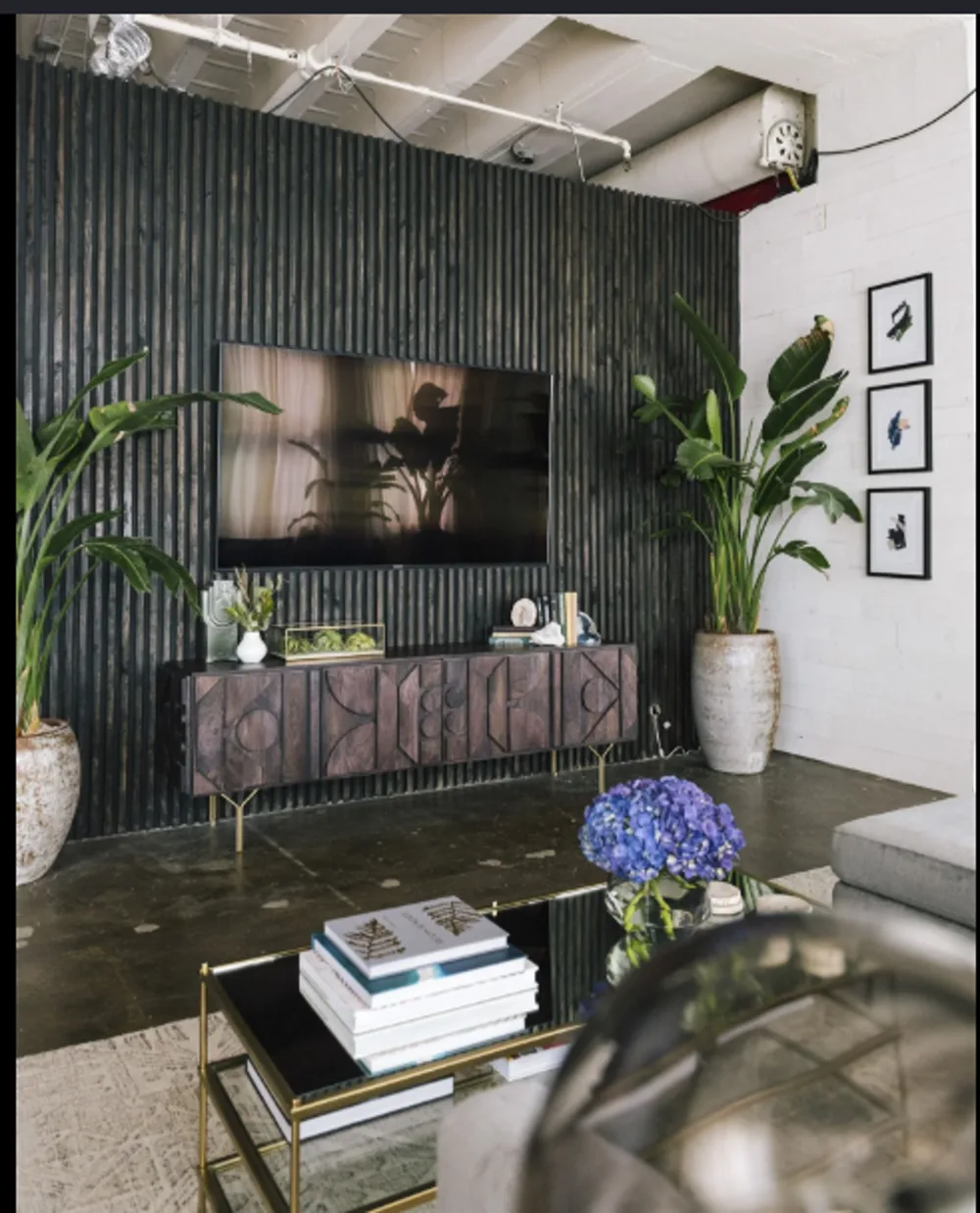 Design inspiration: dark slatted feature wall in a living room with a mounted TV